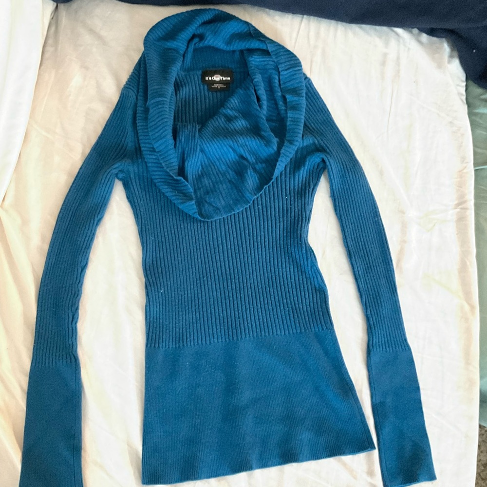 This is a beautiful and warm blue sweater.